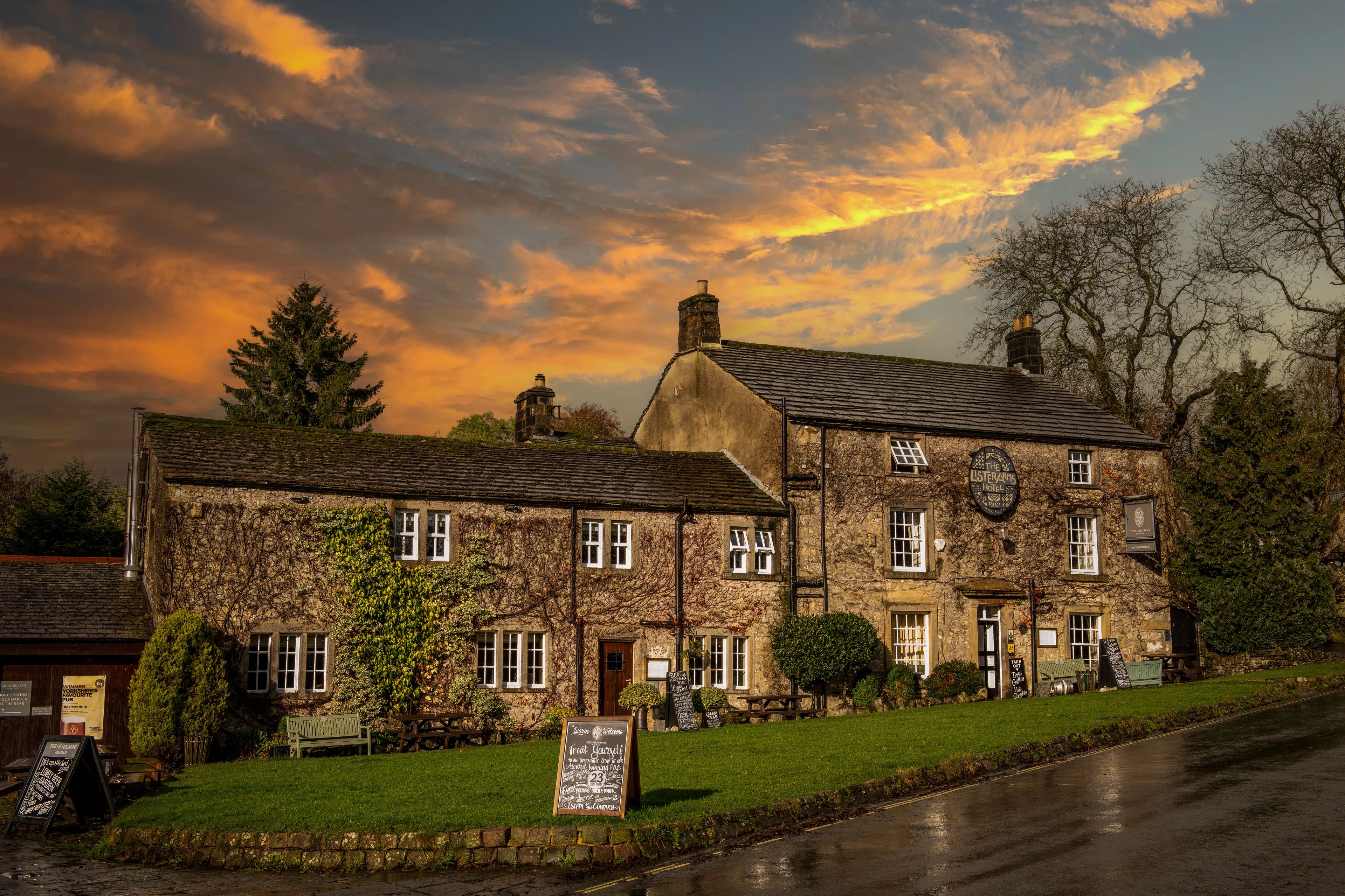 historic stone pub with colorful sunset