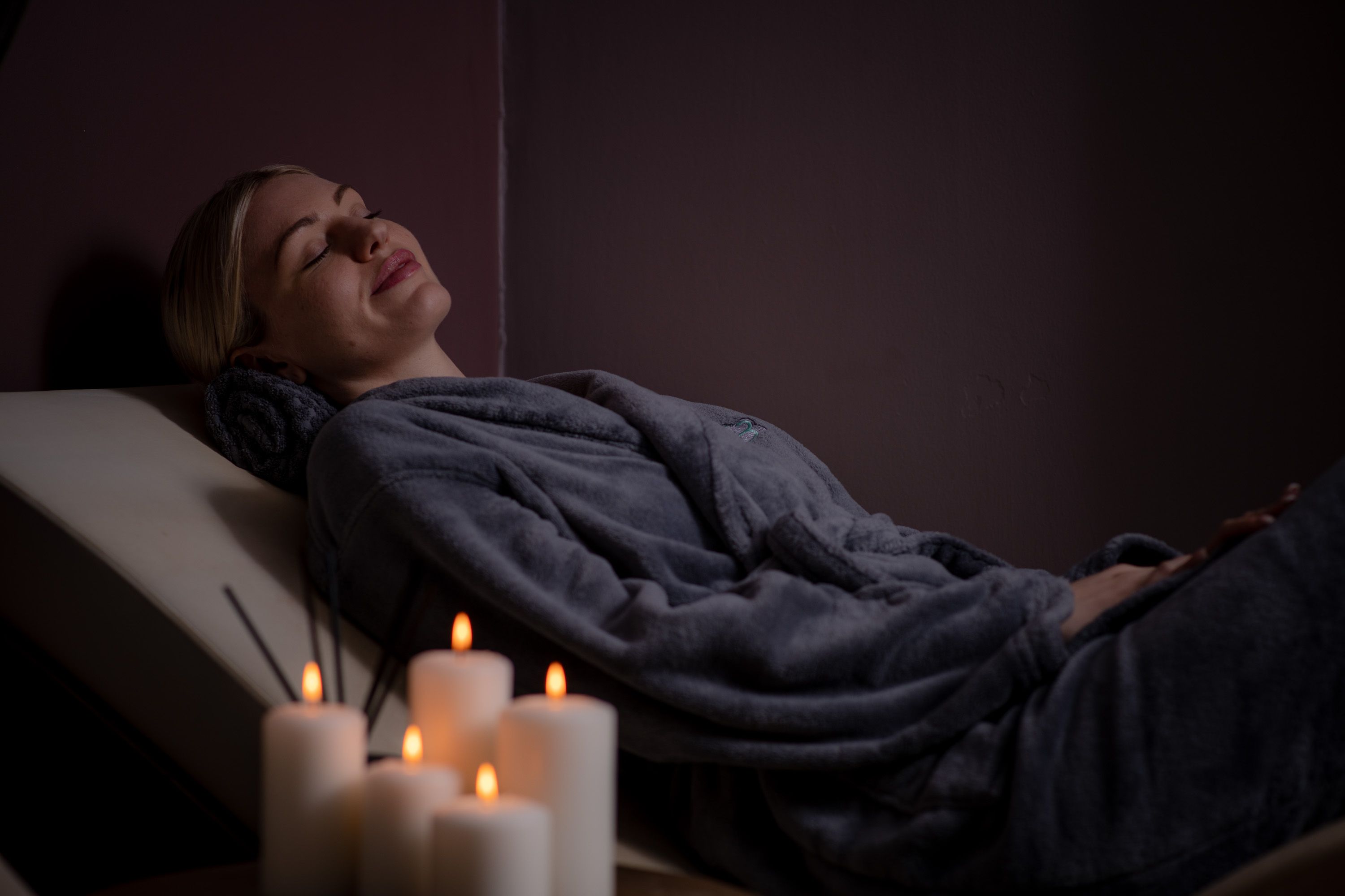 lady relaxing with candles