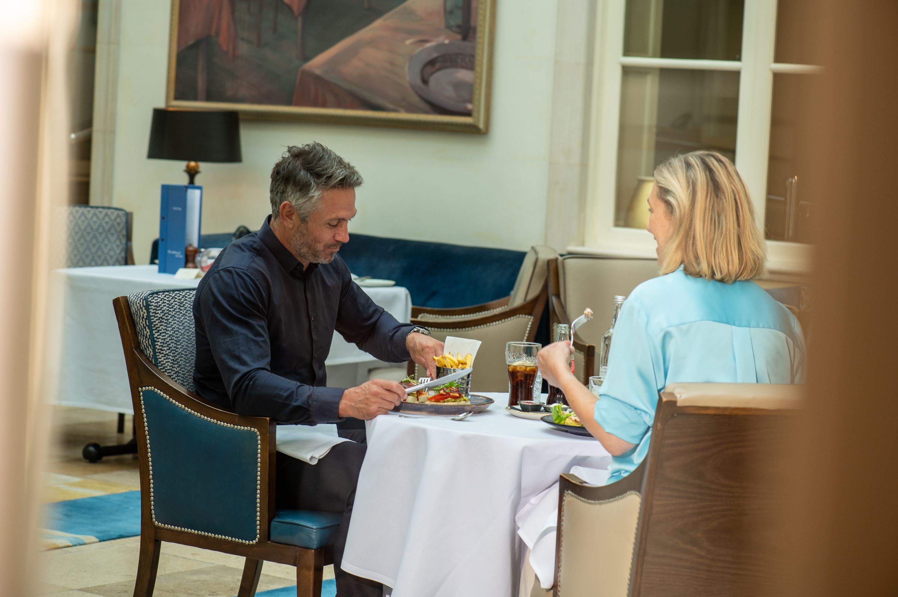 two people having lunch in a hotel lounge