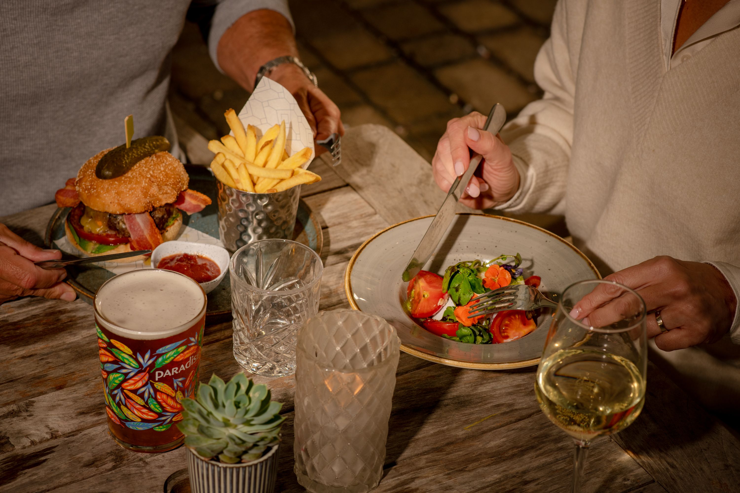 two people eating dinner in a restaurant