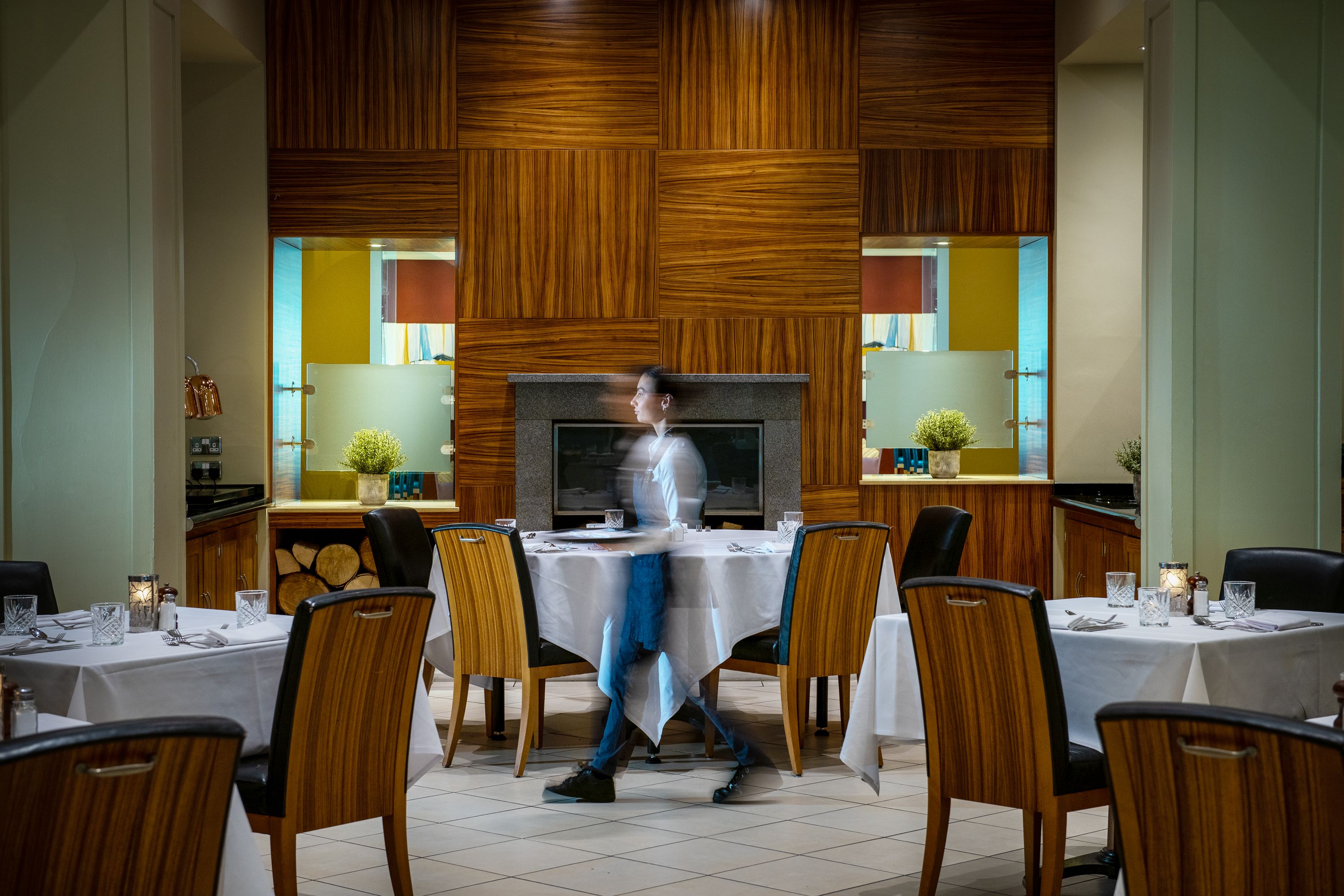 restaurant with waitress walking through